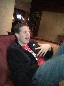 John in the hotel lobby